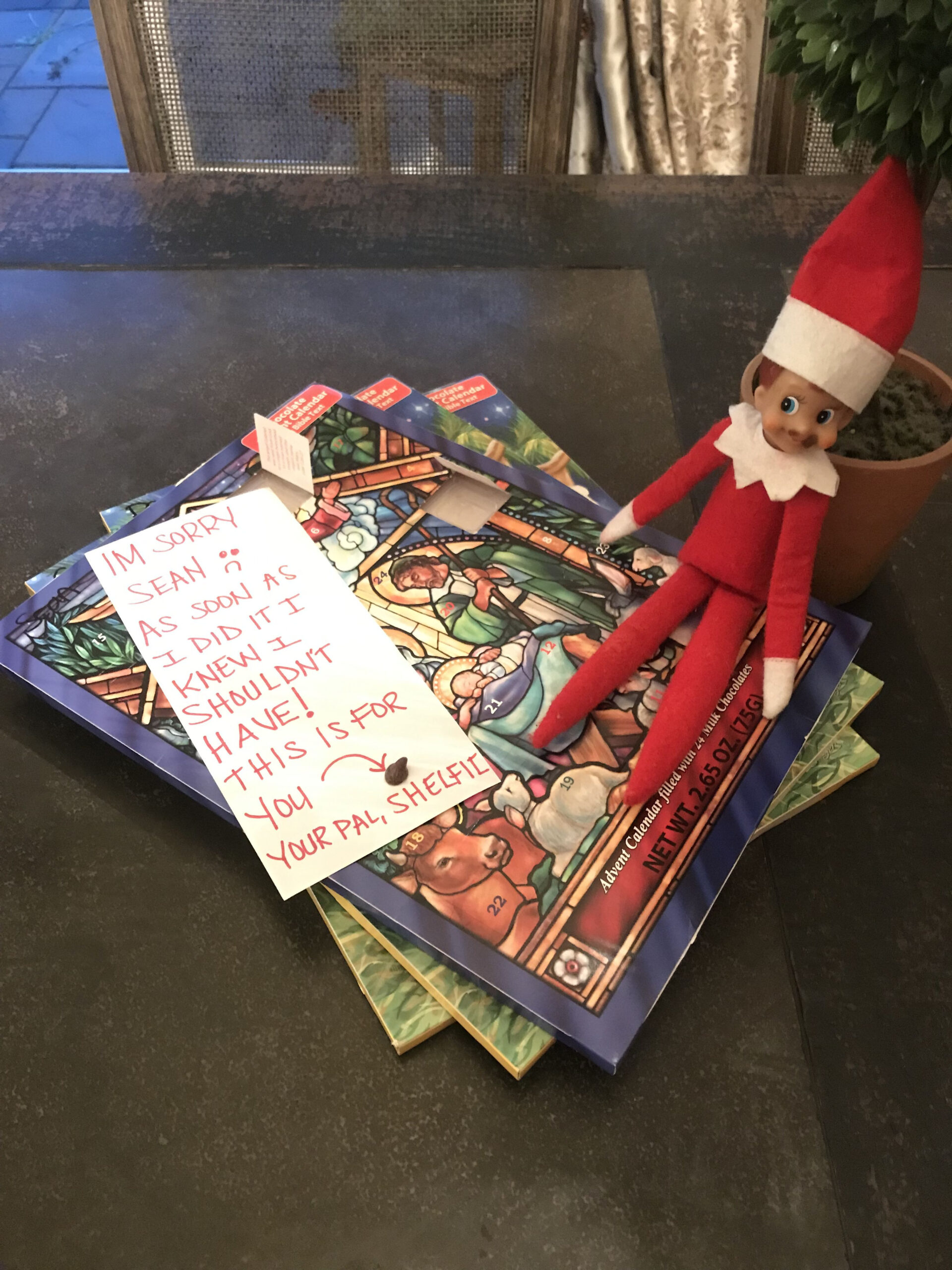 Elf On The Shelf Takes A Piece Of Chocolate From Advent  Chanel Advent Calendar Apology